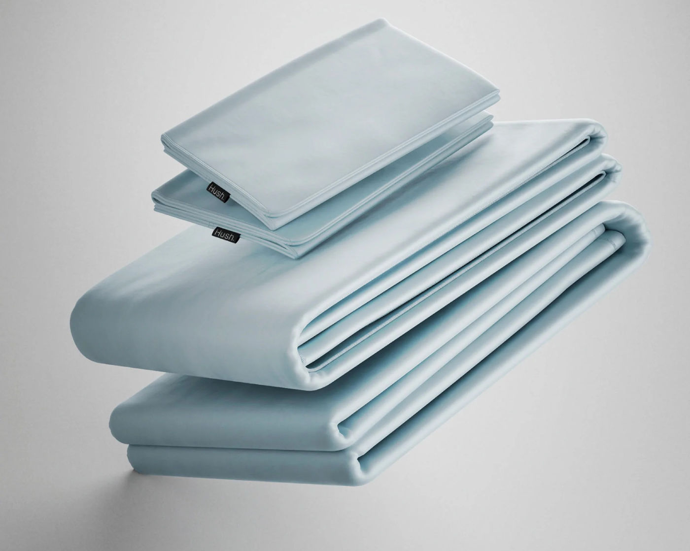 Folded set of light blue Hush Iced Cooling Sheets and Pillowcase.