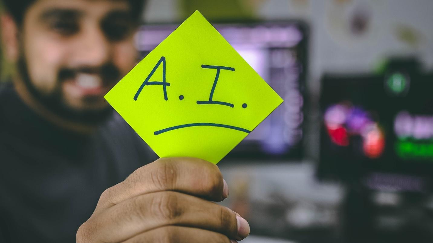 A person holding an AI signage