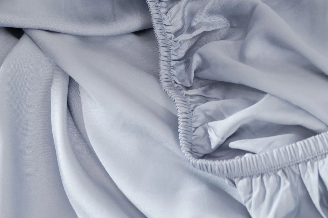 Close up of a Hush Iced 2.0 fitted sheet in cool arctic blue color.