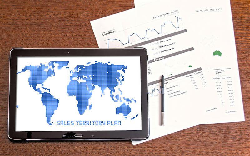 Photograph of tablet and paper with text reading "sales territory plan"