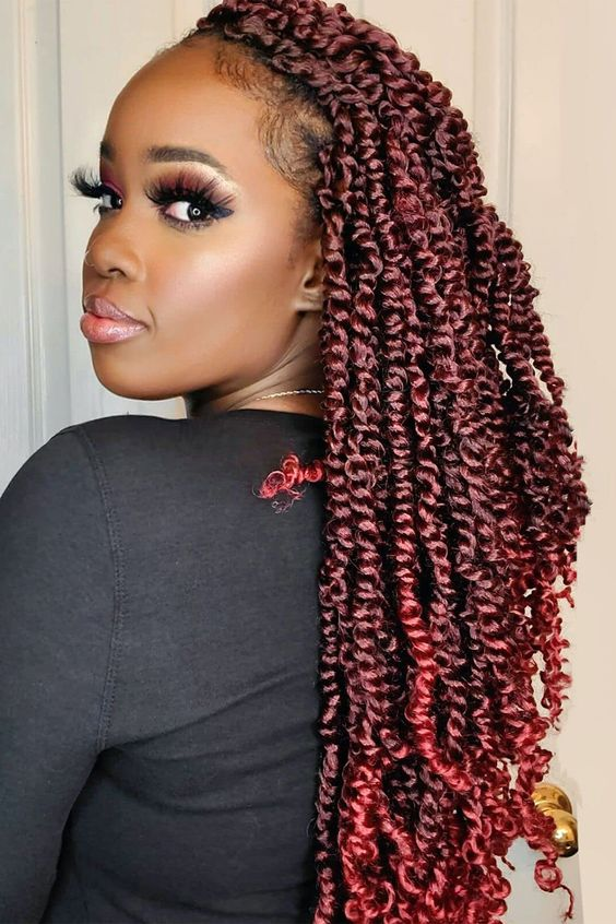 Side view of a lady rocking this coiffure  with red color