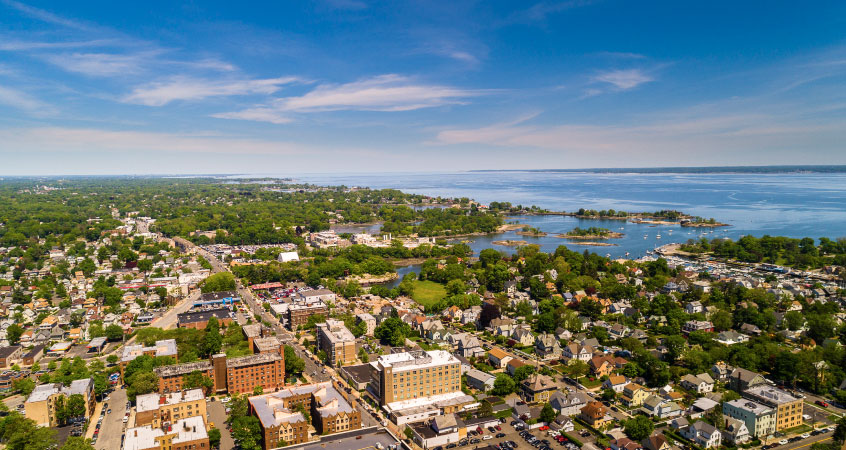 Aerial view of New Rochelle, New York, and its coast on a sunny day.