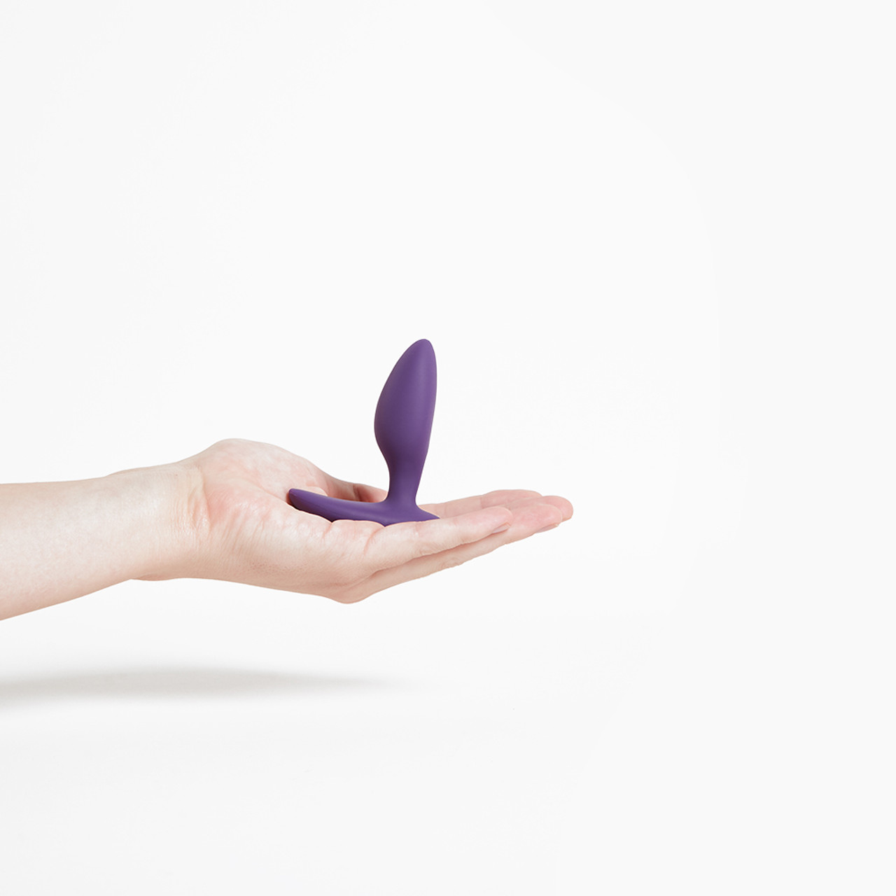 We-Vibe Ditto vibrating anal plug held in hand
