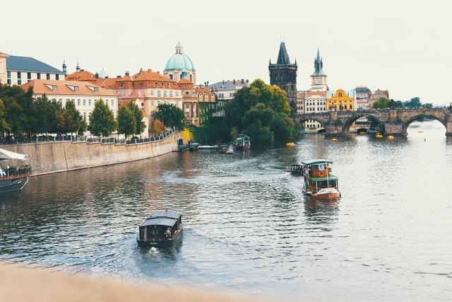 Boats on a river in Czechia, one of the best countries for digital nomads. 