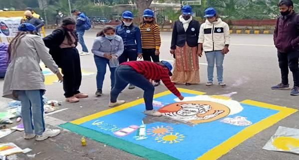 A group of people watching a person do a handstand
Description automatically generated with medium confidence