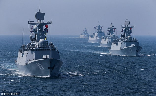 Donald Trump hopes to greatly increase size of the US Navy. His plans, experts say, would take 30 years and would involve the Navy purchasing 321 new ships from now until 2046. He hopes to combat the might of China and Russia. Pictured: A Russian and Chinese naval joint drill