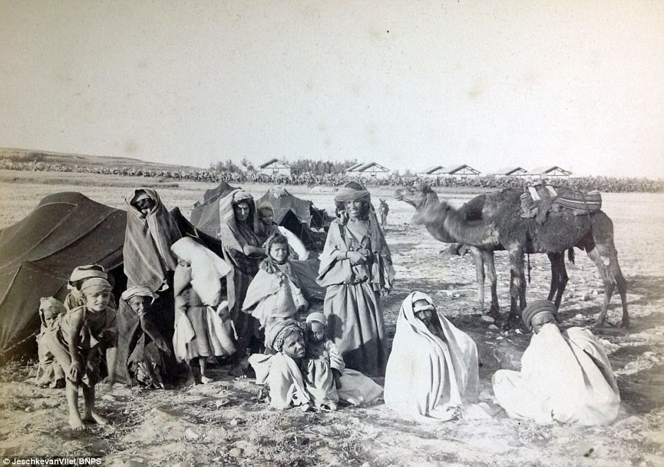 This family were seen with their tents pitched in the desert, with their camel seen in the background