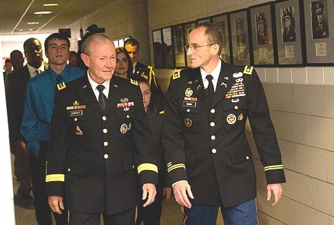 Chairman of the U.S. Joint Chiefs of Staff General Martin Dempsey (L.) and Army Lt. Col Mark Webber walking.