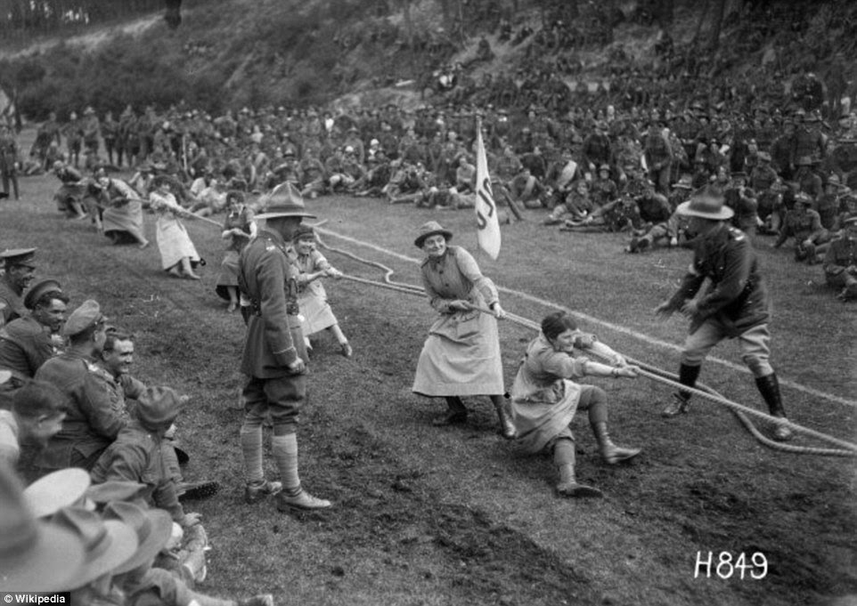 Members of the WAAC kept fit with activities such as Morris Dancing and hockey. Pictured are women taking part in a tug-of-war contest in August 1918 while hundreds of male soldiers watch on