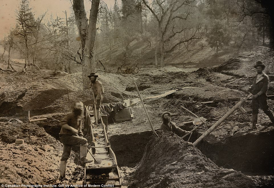 At first glance these four miners seem to be laboring fruitlessly deep in the Californian soils in an Daguerreotype image from 1852, but upon a second glance  image's added gold touches in the sieve on the right and center stairs become evident