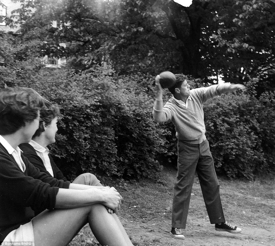 John F. Kennedy, known as Jack, throws a football with his brother Robert while his wife Jackie and Bobby's wife Ethel look on. Suero spent five days with the couple at their Georgetown home