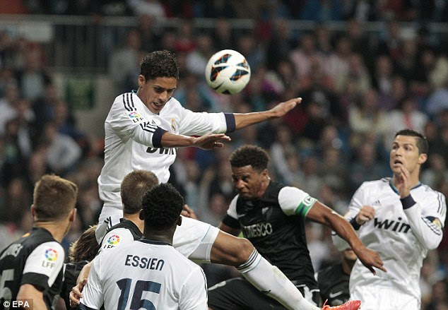 Talent: Madrid's Raphael Varane (heading) has left a significant impact on Mourinho