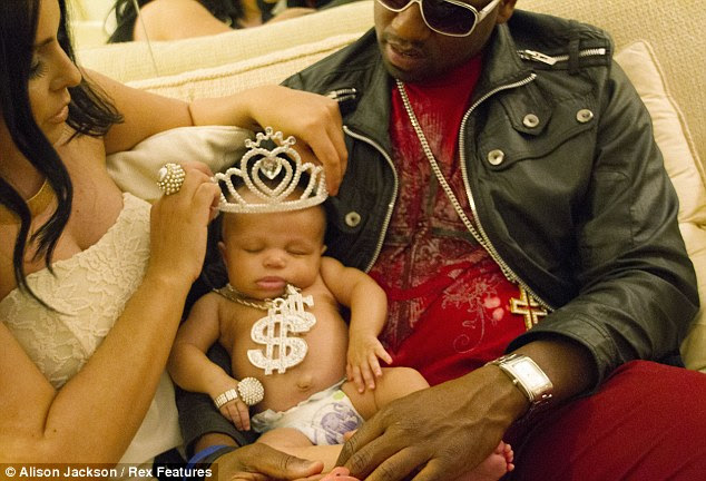 Blingtastic: Kim makes sure her baby shines with a large tiara, as well as necklace and bracelet