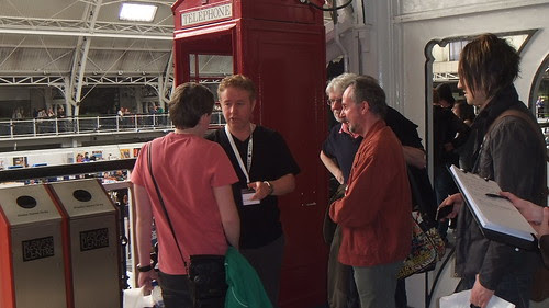 Mark Millar pushed into phone box by fans at Kapow Comic Con 2011 London