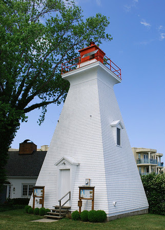 Niagara River Rear Range Lighthouse: Located at the mouth of the Niagara River, Lake Ontario, the light is an active aid to navigation. The 47-foot white square pyramidal wooden tower with red lantern was built in 1903 to mark the channel into the Niagara River
