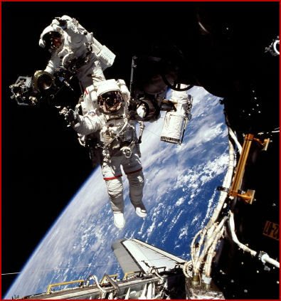 Jeff Williamsn (foreground) and Jim Voss walked in space for nearly seven hours