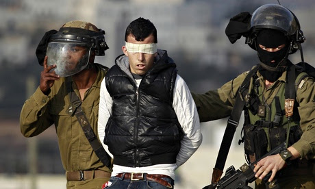 Israeli soldiers arrest Palestinian protest against Jewish settlement