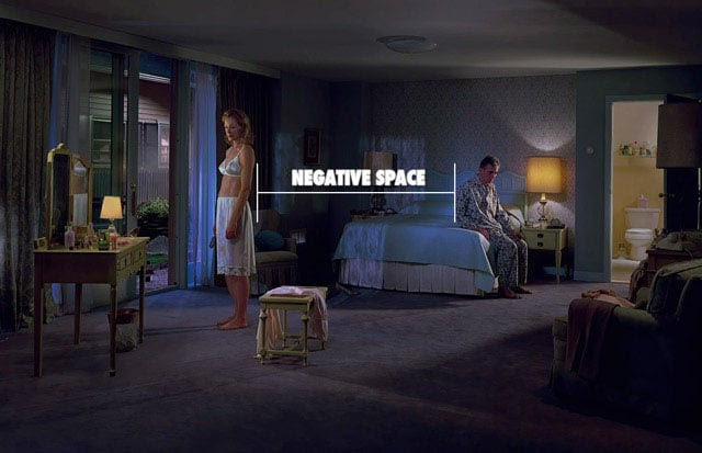 Photograph by Gregory Crewdson using negative space to create tension.