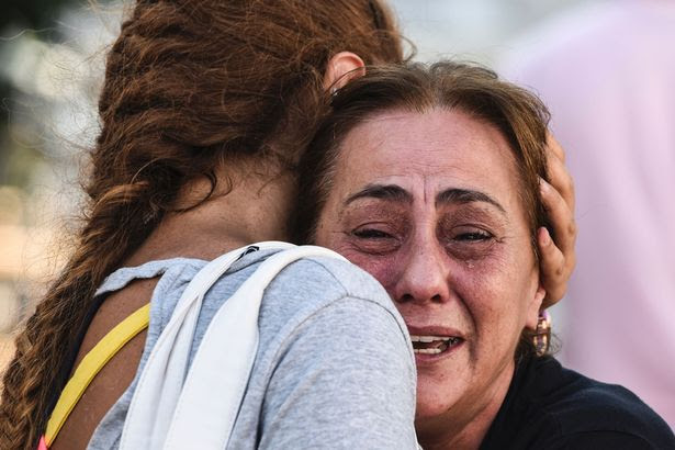 A mother of victims reacts outside a forensic medicine building close to Istanbul's airport