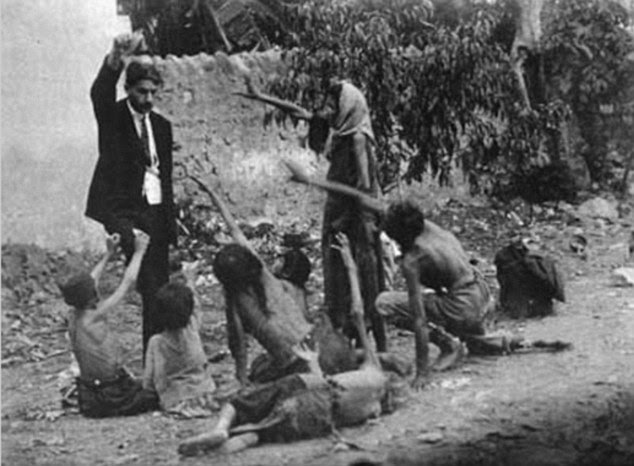 A Turkish official teases starving Armenian children during the genocide in Turkey in 1915