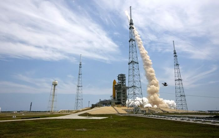 With sister ship ENDEAVOUR and Pad 39B in the foreground, space shuttle ATLANTIS is launched from Kennedy Space Center in Florida on May 11, 2009.