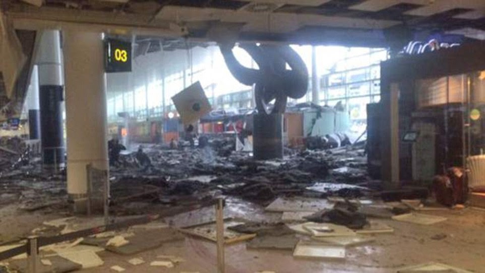 Obliterated: Ceiling tiles and debris are littered across the floor of the terminal building after twins blast rocked the check-in area