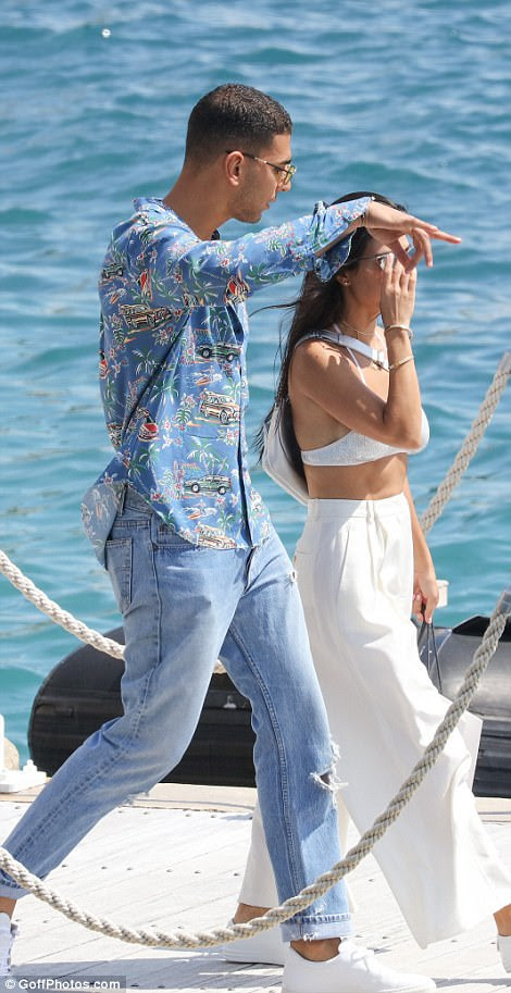Lovebirds: Kourtney Kardashian, 38, and her new toyboy Younes Bendjima, 24, looked blissfully happy as they enjoyed yet another day out together in the celebrity hotspot, leaving the Eden Roc Hotel in Antibes together by boat on Wednesday