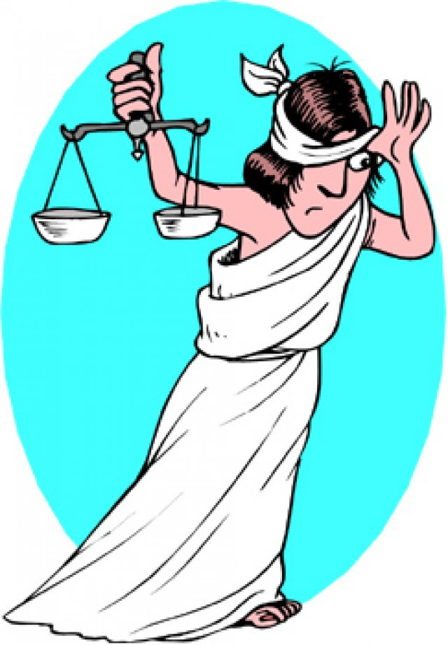 Lady justice peaking from behind her blindfold