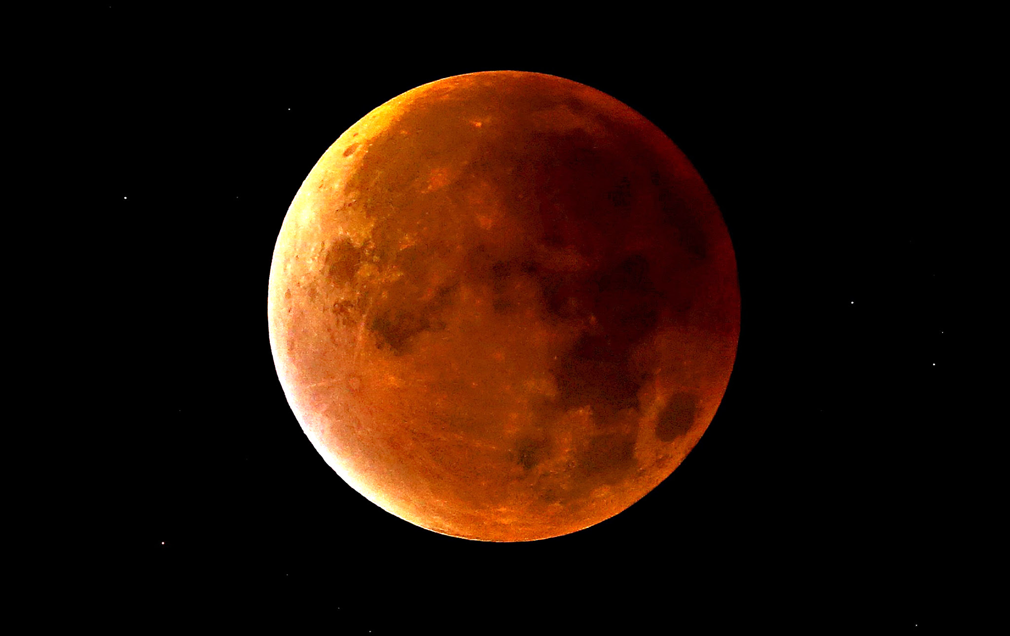A lunar eclipse coincides with a so-called "supermoon" in Newcastle-under-Lyme, Staffordshire, England. Sky-watchers around the world are in for a treat Sunday night and Monday when the shadow of Earth casts a reddish glow on the moon, the result of rare combination of an eclipse with the closest full moon of the year