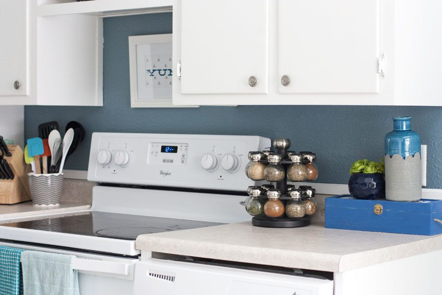 This happy kitchen is full of whites, blues and greens. Shows even small kitchens can look pretty!