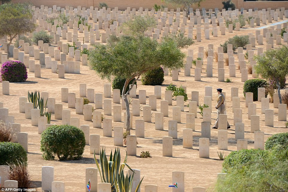 A soldier walks past the graves of fallen World War II soldiers, on October 20, 2012, during an international commemoration organized by Britain, to mark 70 years since the decisive battle that sealed the Allied victory in North Africa