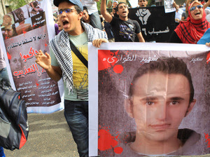 Egyptian youths demonstrate against the death of Khaled Said, allegedly at the hands of police