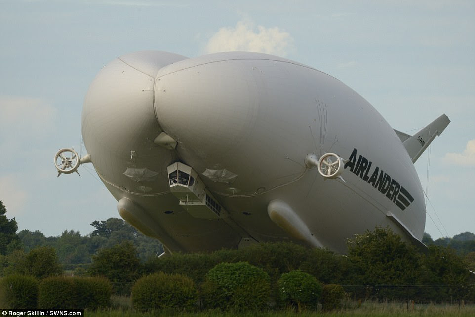 Hundreds of people gathered to watch the 20-tonne Airlander 10 perform aerial manoeuvres in a four-hour flight that took off from Cardington, Bedfordshire