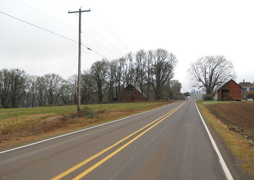 Two barns flank the road