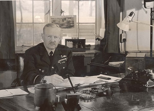 Commander: Air Marshal Arthur 'Bomber' Harris, who planned the majority of the RAF's night raids during World War II, is seen at work in his office