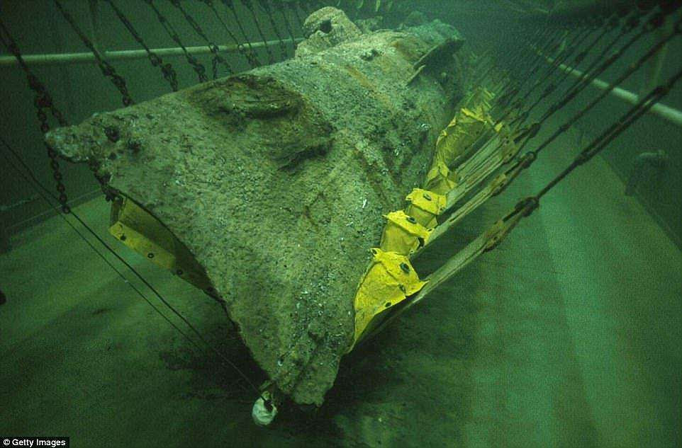 The Hunley was raised from the bottom of the ocean in 2000. The 75,000-gallon tank of water and chemicals that houses the vessel (pictured) is drained three times a week for several hours to allow restoration work to take place