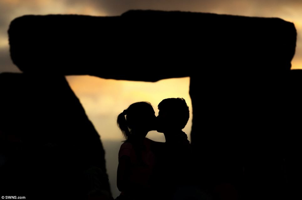 Boaz Sobrado and his girlfriend Lolita Honich, from Hungary, kissed during a sunset ceremony at Stonehenge