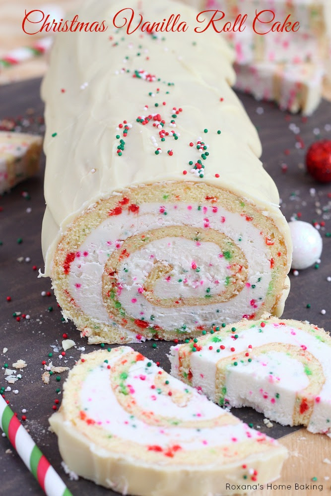 A simple vanilla roll cake with red and green dots and spirals of creamy buttercream. Recipe from Roxanashomebaking.com