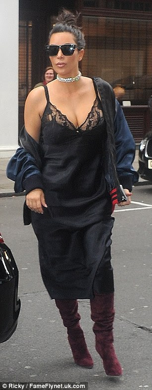 Lovely in lace: The Keeping Up With the Kardashians star put her ample assets on full display in the lingerie inspired piece which boasted a low-cut neckline and racy lace inserts around the bust