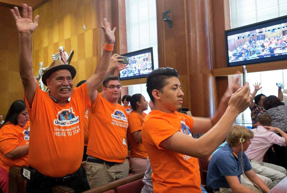People with United We Dream celebrate after council members voted to join the lawsuit against SB4 during a City Council meeting at City Hall Wednesday, June 21, 2017, in Houston. Photo: Godofredo A. Vasquez, Houston Chronicle / Godofredo A. Vasquez