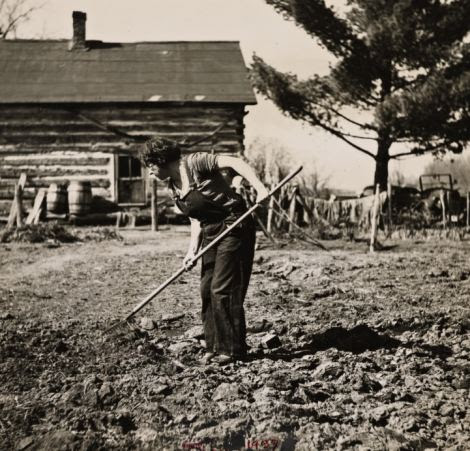 The photo shows a farmer's wife near Gibbs City, Michigan in 1937