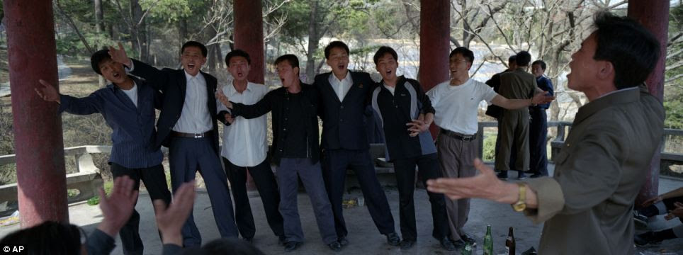 Social times: Men drink and sing inside a pagoda at a hilltop park overlooking Pyongyang
