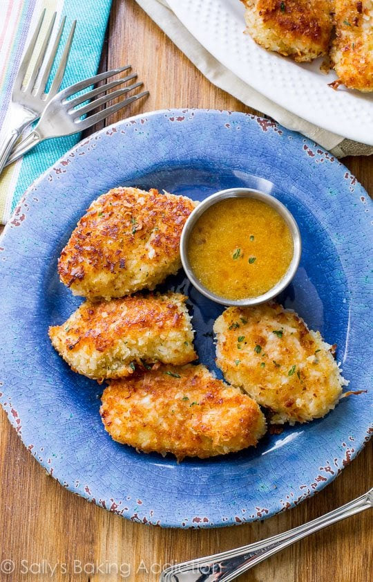 All things Coconut - 25 Yummy Coconut Recipes you need to try - Ioanna's Notebook Recipe for Crispy Coconut Chicken with Spicy Honey Orange Sauce for dipping! sallysbakingaddiction.com