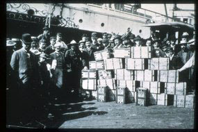Two tons of newly unloaded Klondike gold on the wharfs of Seattle