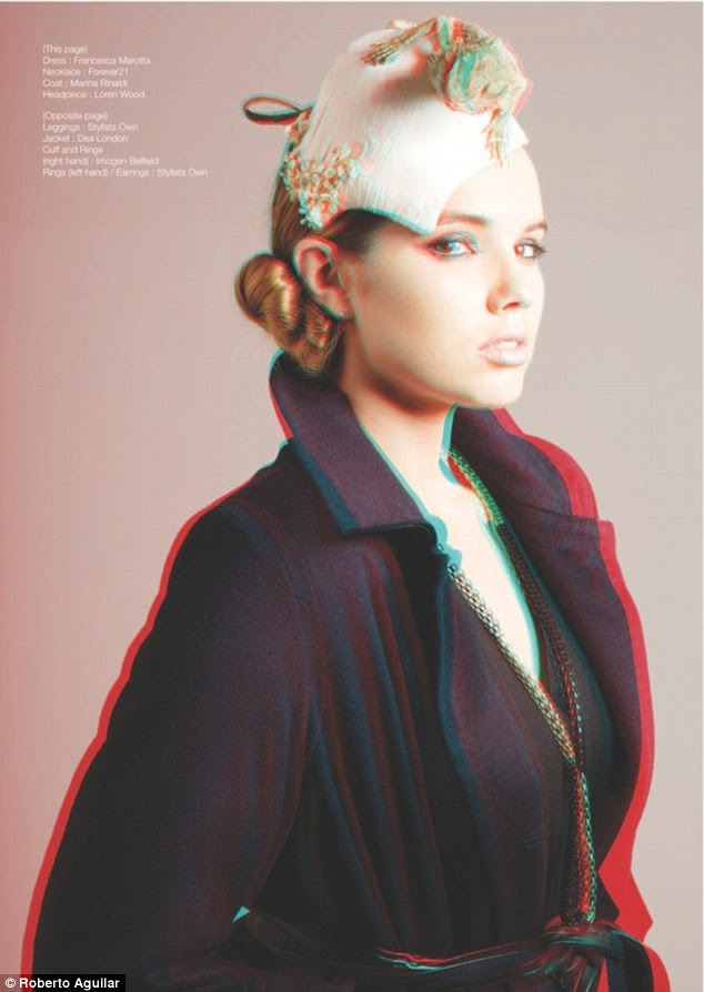 Warren wears a coat by Marina Rinaldi, a dress by Francesca Marotta and a head piece by Loren Wood.