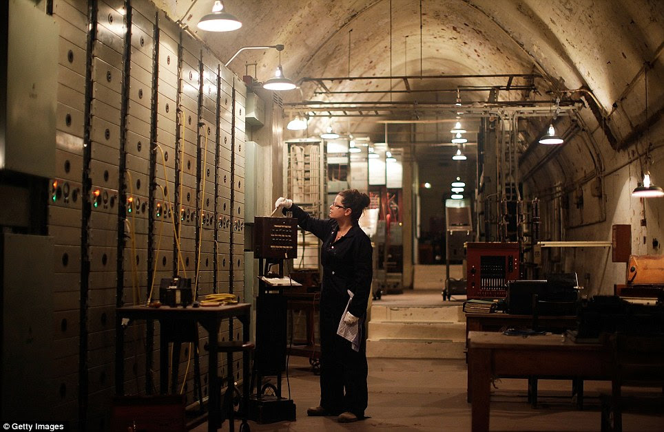 Evocative: Curator Joanne Gray puts the finishing touches to the Repeater Station in the subterranean tunnels underneath Dover Castle, where the Dunkirk evacuation was planned