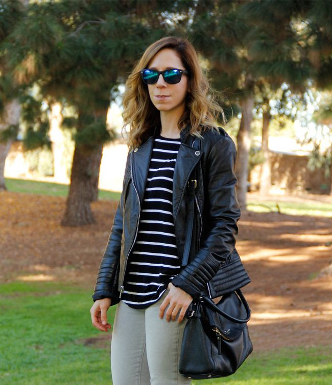 LA fashion and personal style blogger The Key To Chic wears a striped a.n.a. top, Michael Michael Kors leather moto jacket, grey J Brand skinny jeans, Kate Spade Cobble Hill Little Minka bag, and Adidas Superstar 2 sneakers