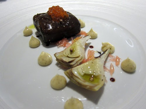 Salmon poached in licorice gel served with an artichokes vanilla mayonnaise.