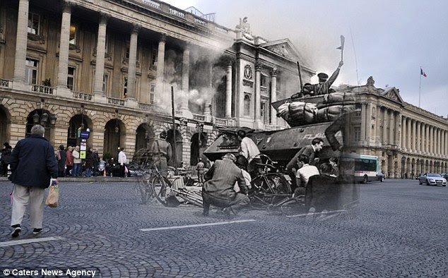 People hide behind a tanks in the streets of Paris, as in the modern day street shoppers go about their daily business