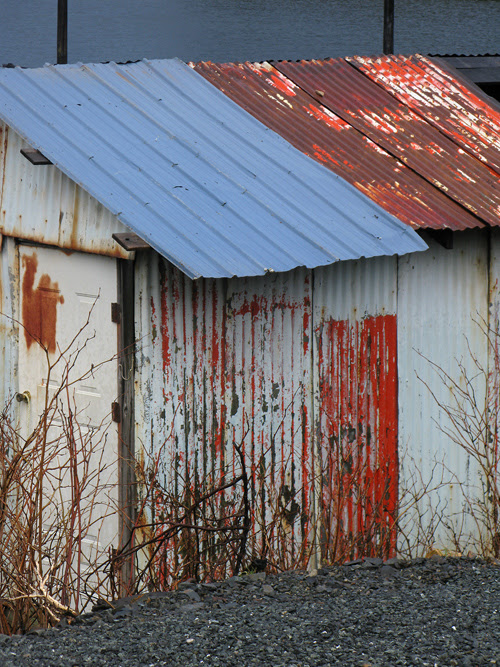 rust and paint and more color a shed in Hydaburg, Alaska